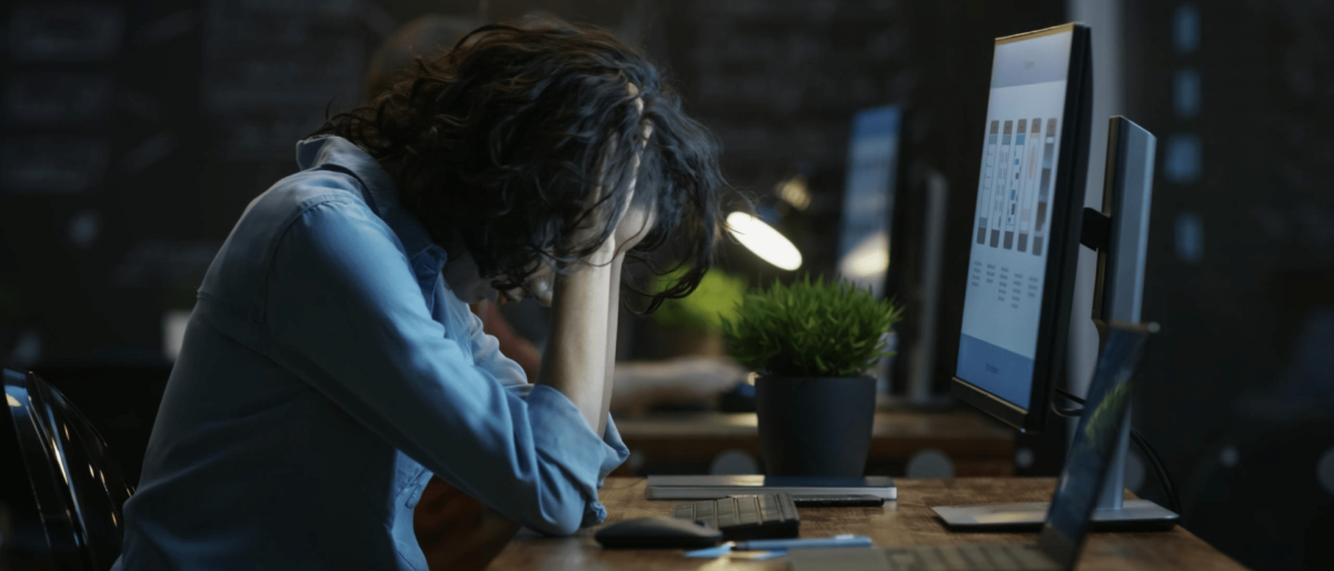 woman at computer stressed about social media disaster