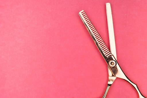 scissors on pink background