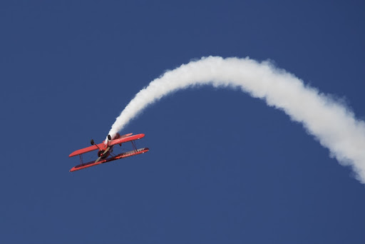 plane swaying to the side with a vapour trail coming from the back