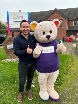 Jake with Rainbows Hospice mascot, Bow Bear