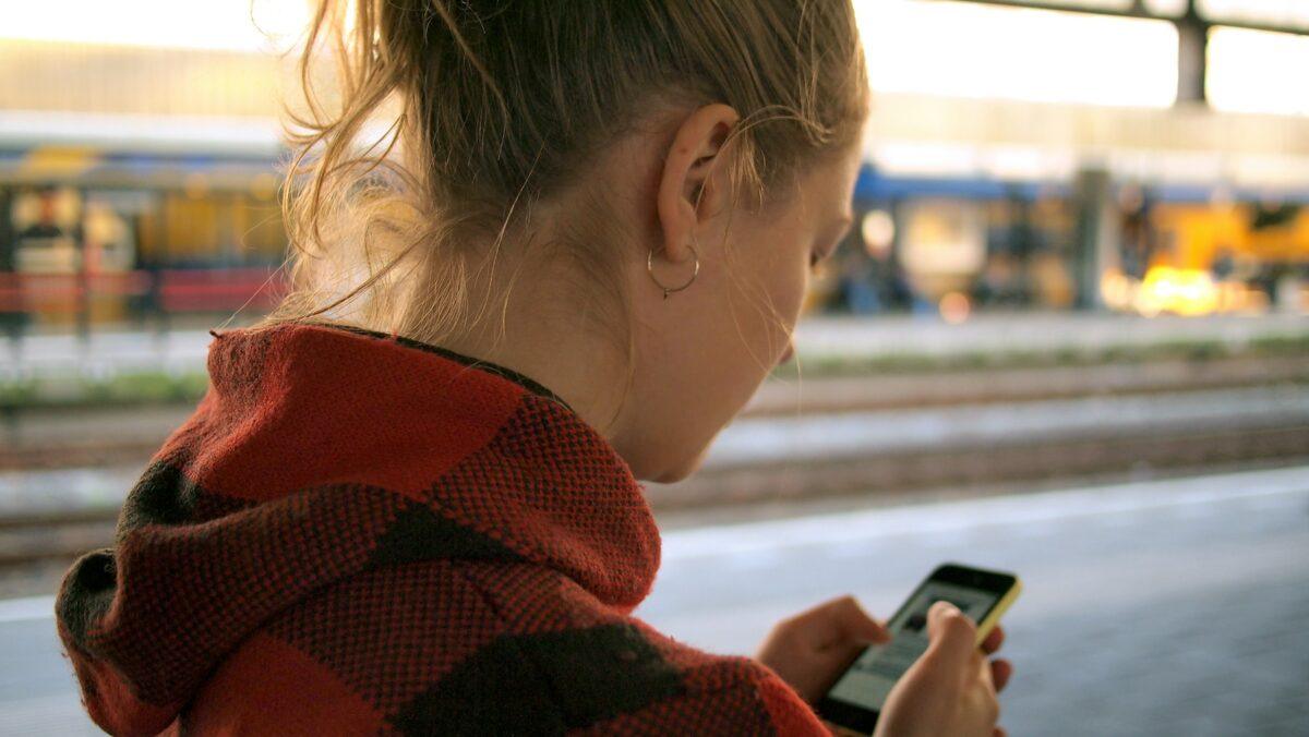 lady on phone looking into distance
