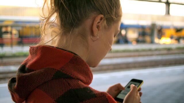 lady on phone looking into distance