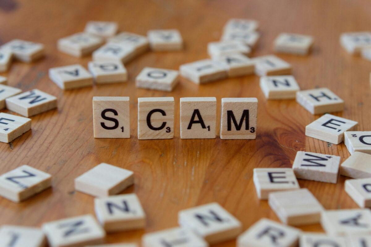 Scrabble word that says Scam