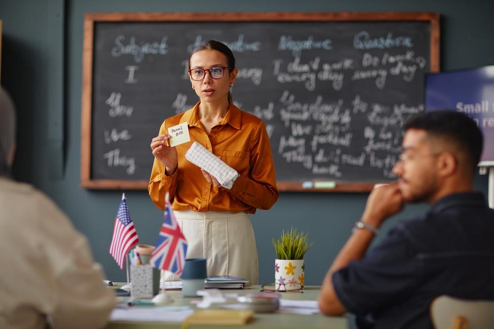 Caucasian,Young,Adult,Woman,Teaching,Language,Lesson,Holding,Flashcard,And